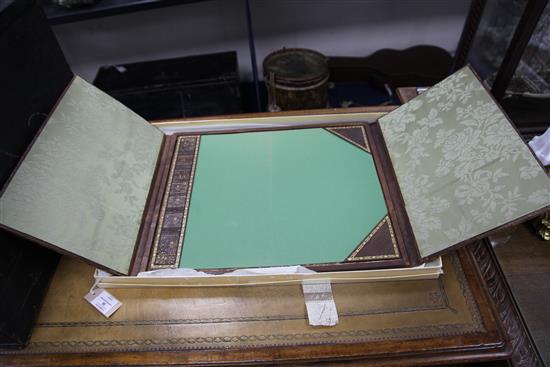 A French gilt tooled and brown leather double folding desk blotter, W.1ft 8in.